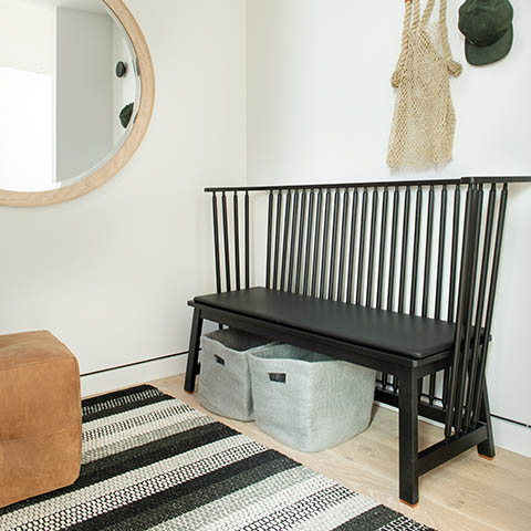 modern entry way featuring a de la espada low settle bench