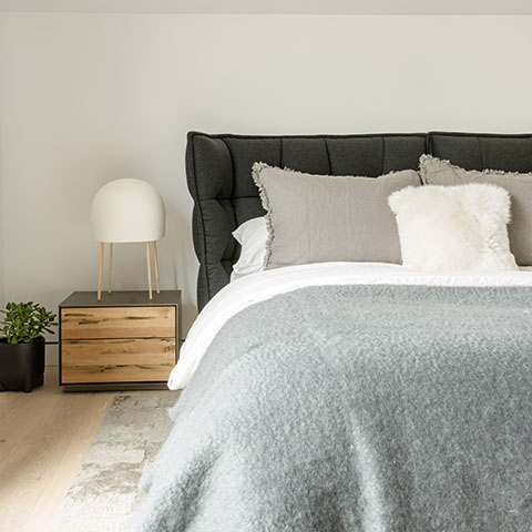 modern bedroom featuring a b&b italia husk bed