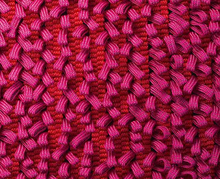 detail of paola lenti air rug in pinks and reds