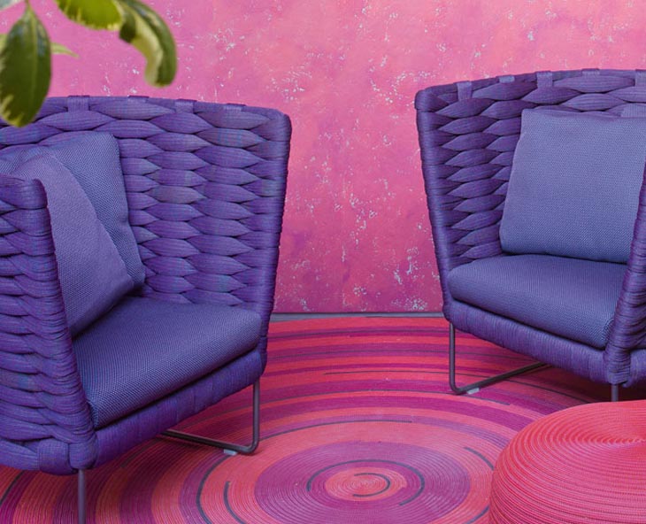 outdoor patio featuring paola lenti ami armchairs in purple