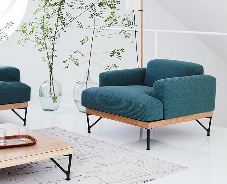 modern living room featuring armstrong armchair by de la espada