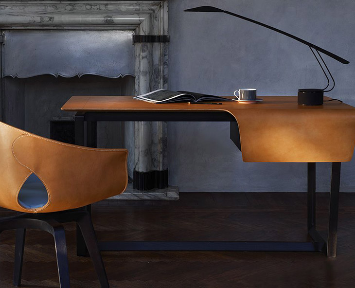 home office space featuring poltrona frau fred desk