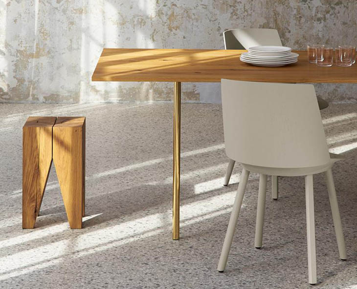 modern dining room featuring e15 backenzahn stool and houdini chair