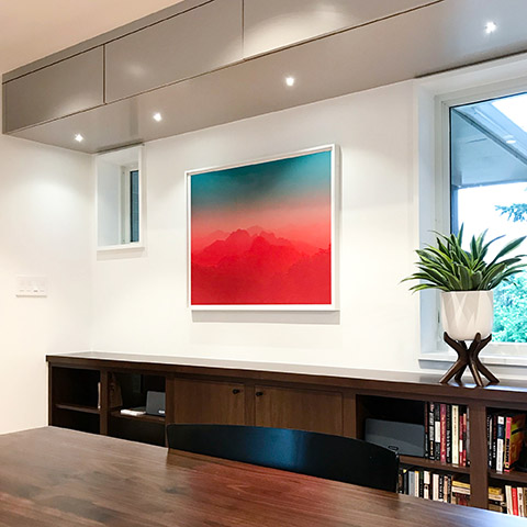 art by jamie kripke hanging in a modern office