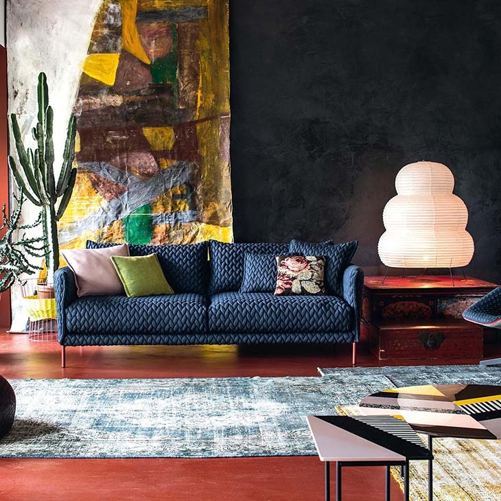 blue moroso gentry sofa in an artsy bohemian living room