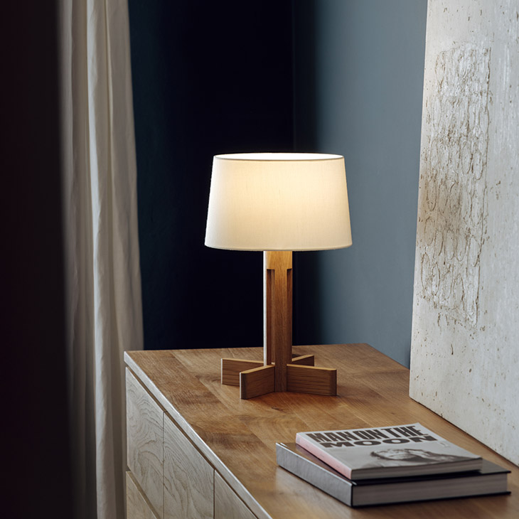 santa & cole fad table lamp on a dresser