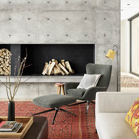modern living room in jackson wyoming featuring a minotti jensen bergere and ottoman