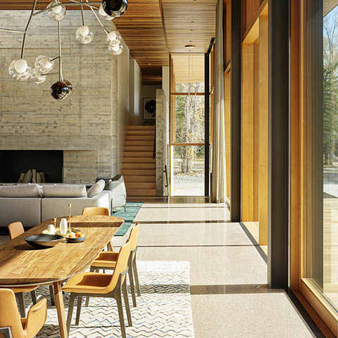 modern house in jackson wyoming featuring a custom bocci pendant