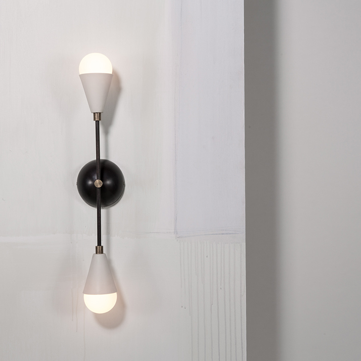 apparatus triad 2 sconce on an off-white wall