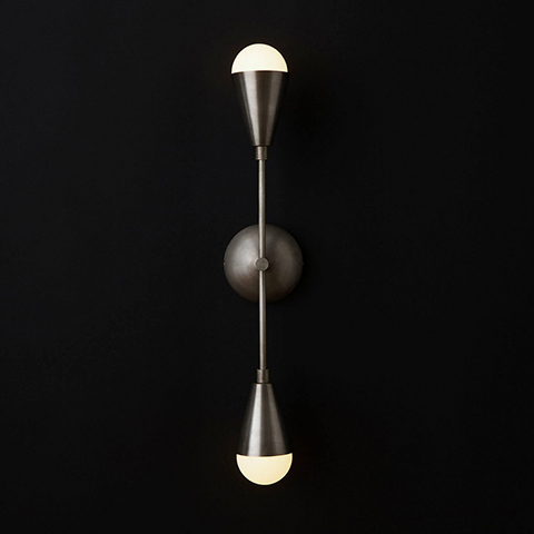 apparatus triad 2 sconce on a black background