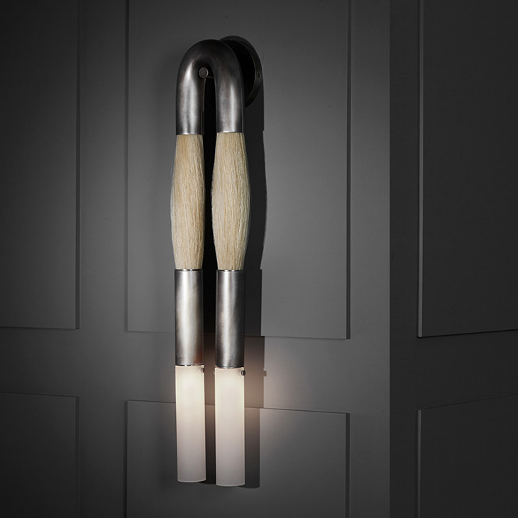 apparatus horsehair sconce in a dark room
