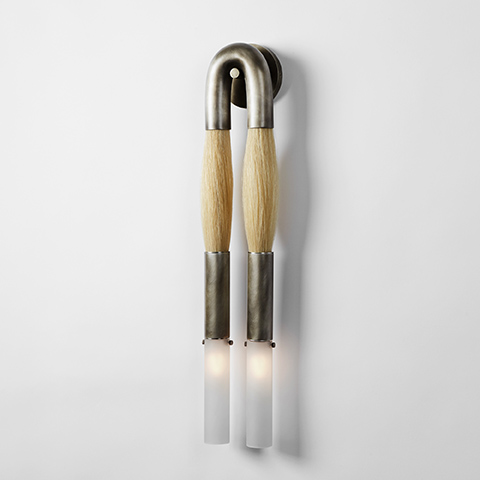 apparatus horsehair sconce on a soft grey background