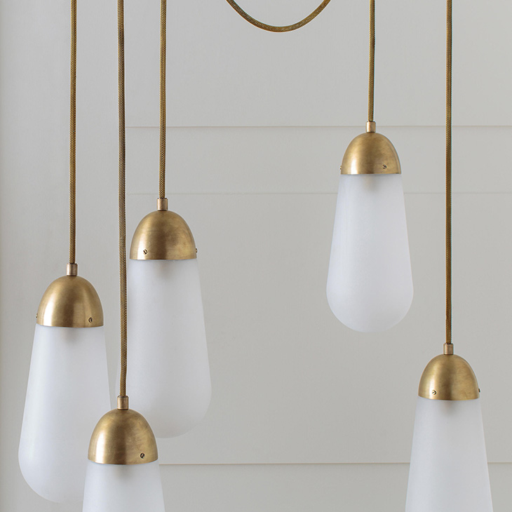 apparatus lariat pendant light installation in a white room