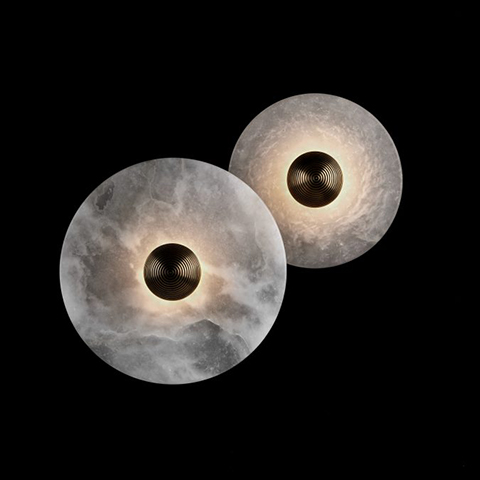 both sizes of the apparatus median sconces on a black background