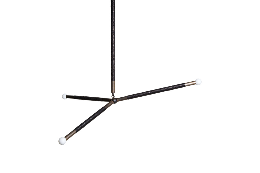 apparatus arrow pendant with python wrap on white background