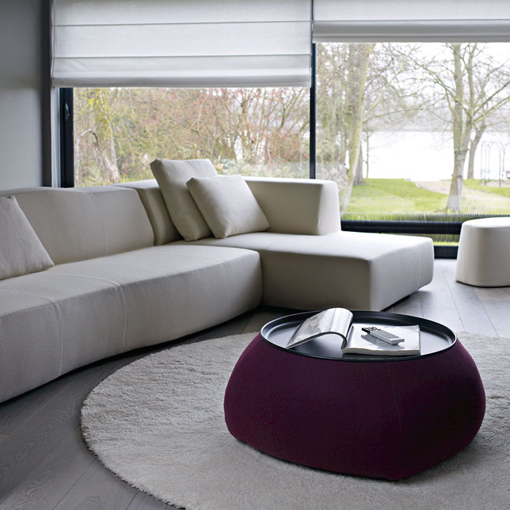 modern living room featuring a b&b italia fat fat ottoman