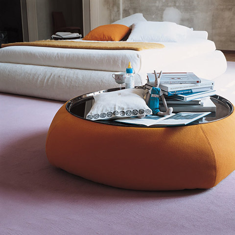 modern bedroom featuring a b&b italia fat fat ottoman