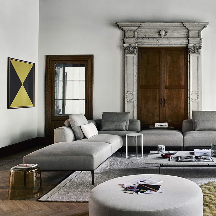 modern living room in a historic house featuring a b&b italia harry large ottoman