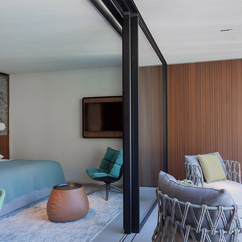 modern bedroom and patio featuring b&b italia husk armchair wood base