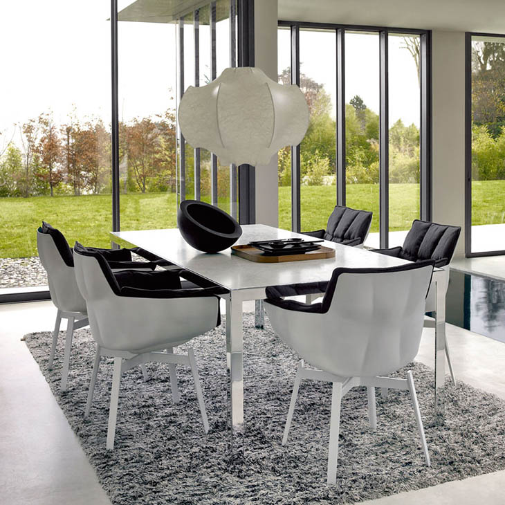 dining room featuring b&b italia husk chairs with white metal base