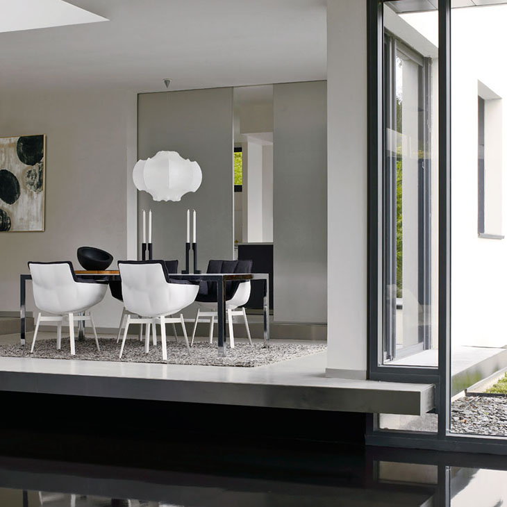 dining room featuring b&b italia husk chairs with metal base