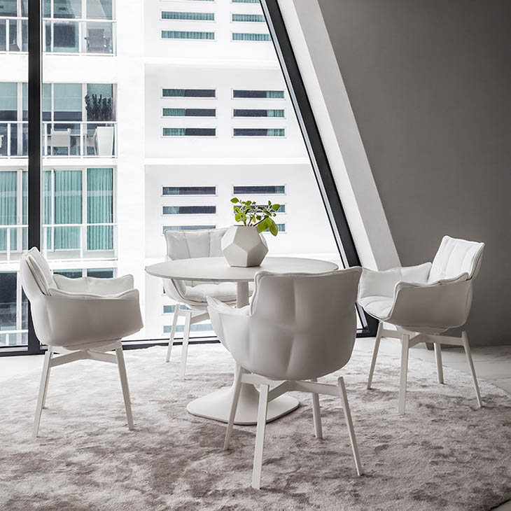 dining room featuring b&b italia husk chairs with metal base
