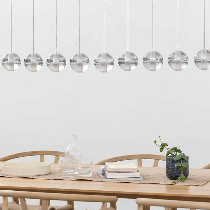 modern dining room featuring bocci 14 series pendant light