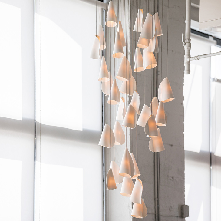 modern industrial space featuring bocci 21 series pendant light