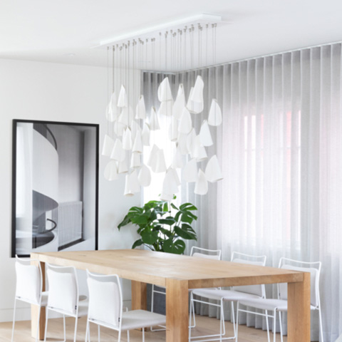 modern dining room featuring bocci 21 series pendant light