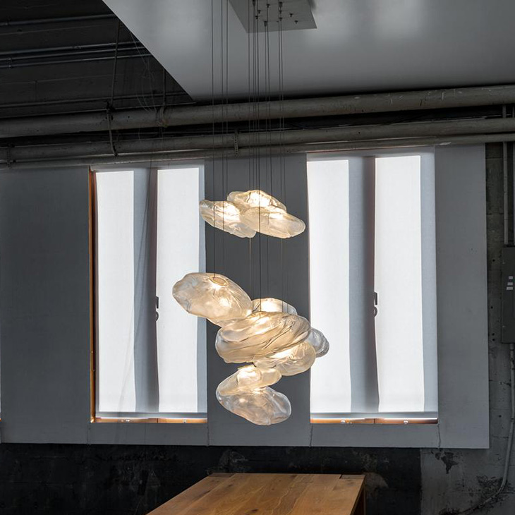 dining room featuring bocci 73 pendant light
