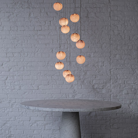 foyer featuring 84 series pendant lights hanging over round marble table