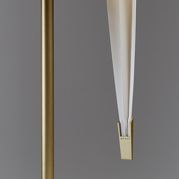 close up of a moooi perch light table lamp on a grey background
