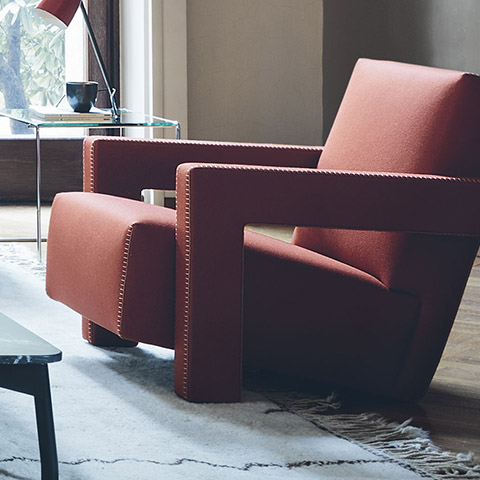 modern living room featuring cassina utrecht armchair