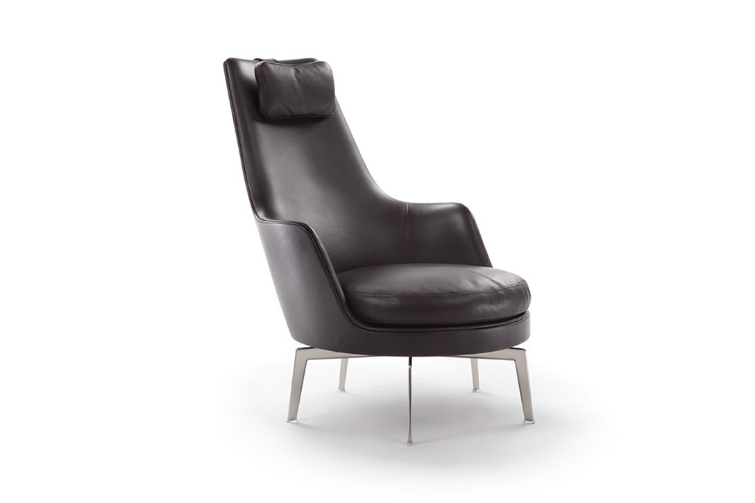 black leather flexform guscioalto armchair on a white background