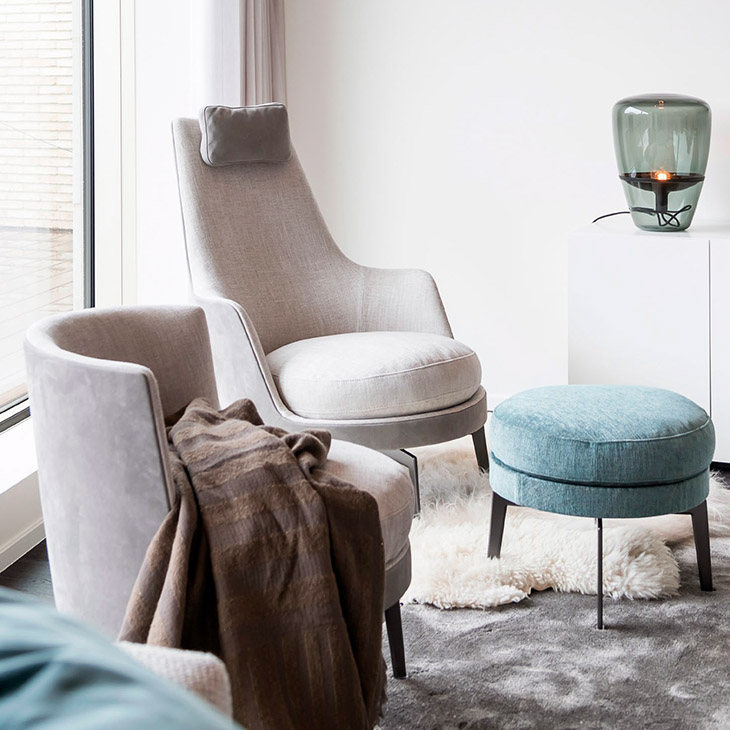 modern living room featuring a flexform guscioalto armchair