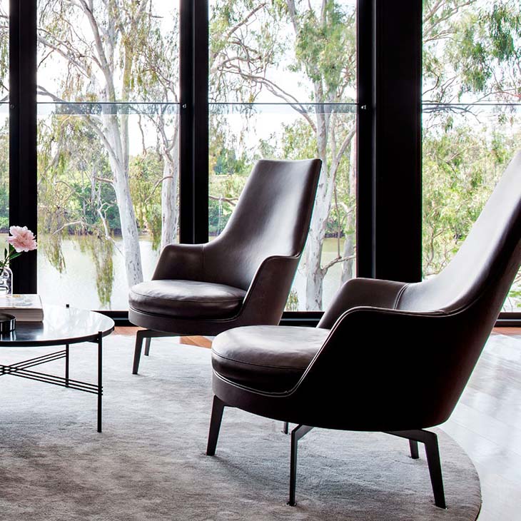 modern living room featuring two flexform guscioalto armchairs