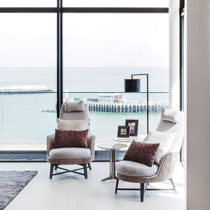 modern living room featuring two flexform guscioalto armchairs