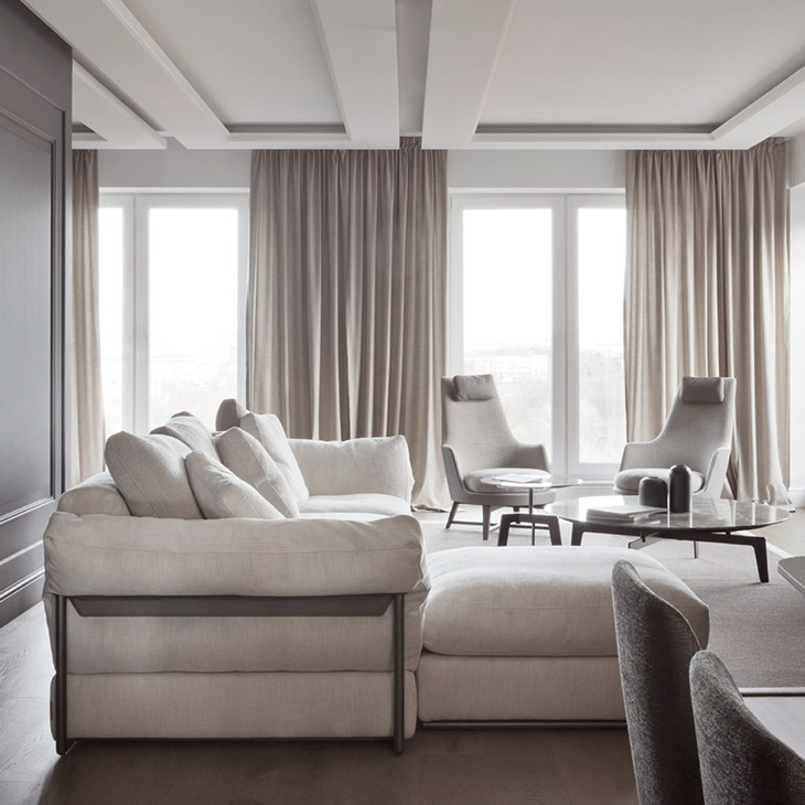 modern living room featuring a two flexform guscioalto armchairs