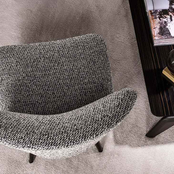 modern sitting area featuring minotti aston armchair