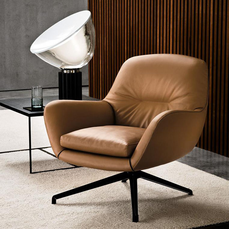 modern living room featuring minotti jensen armchair