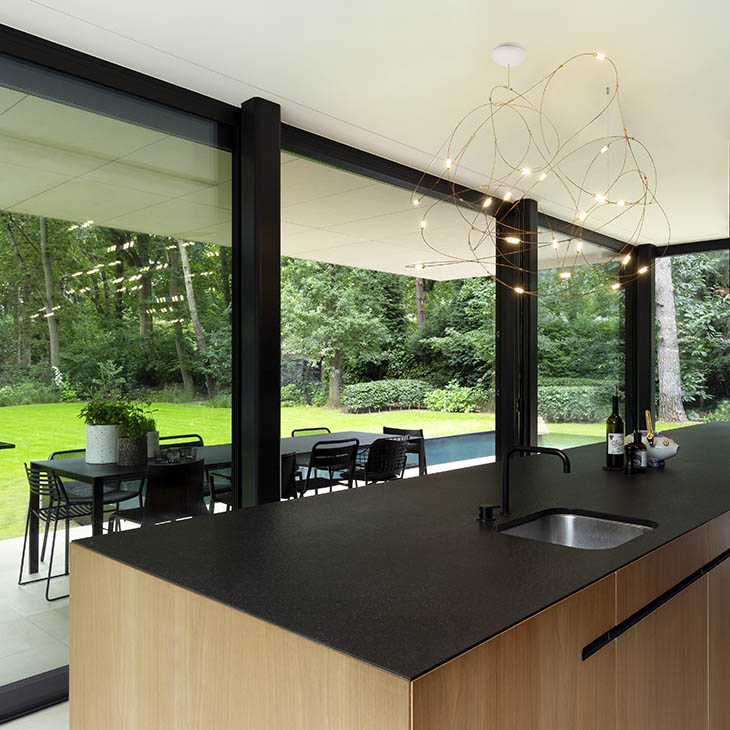 modern kitchen featuring moooi flock of light pendant