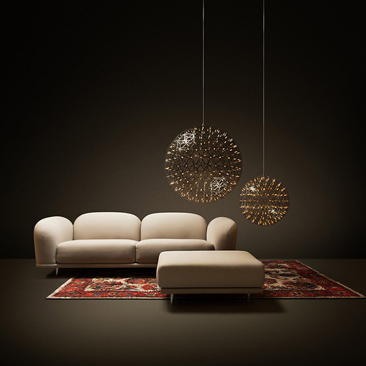 moooi two raimond ii pendant lights glowing in a dark room