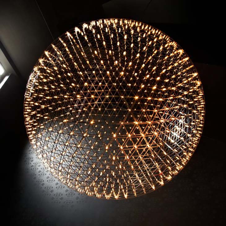 moooi raimond r199 pendant light glowing in a dark room