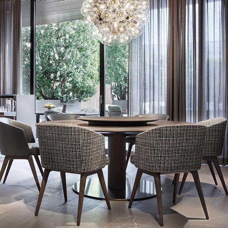 modern dining room featuring a minotti bellagio dining table