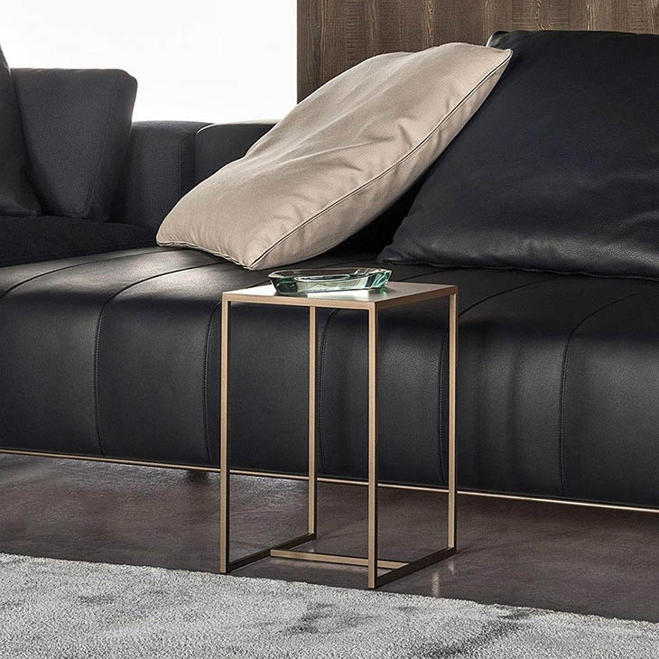 modern living room featuring a minotti duchamp bronze table