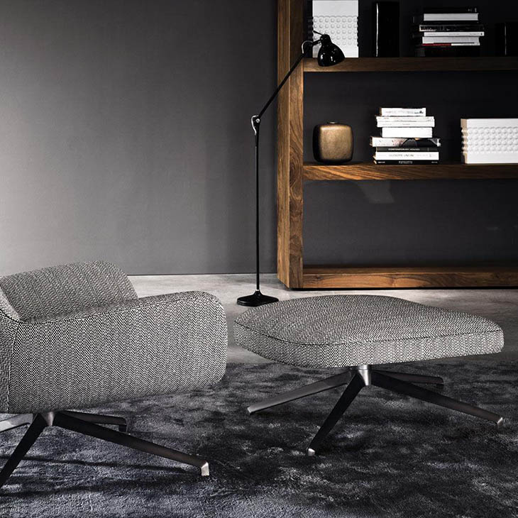 modern living room featuring minotti jensen armchair and ottoman