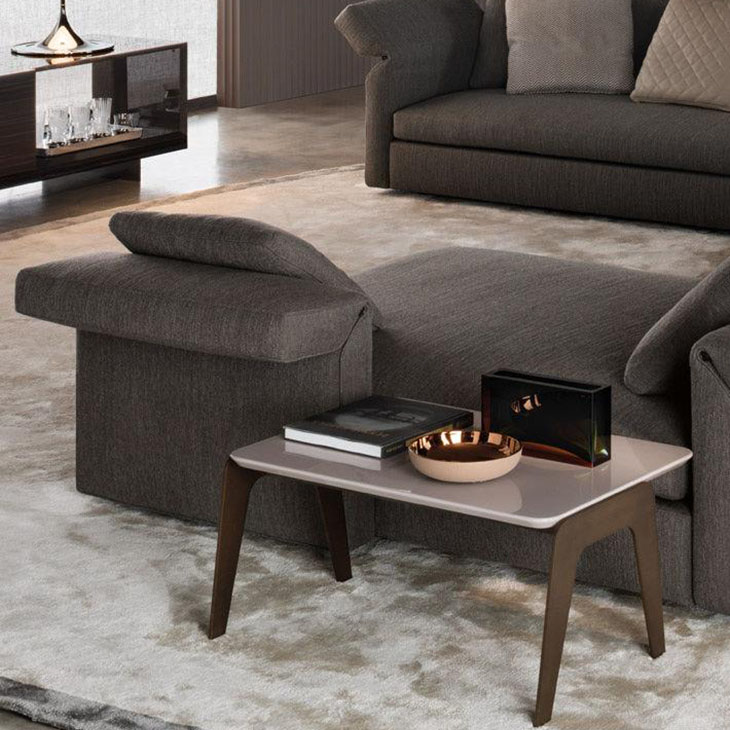 modern living room featuring a minotti kirk jut out top side table