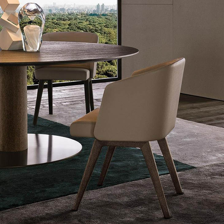 modern dining room featuring minotti reeves dining chairs