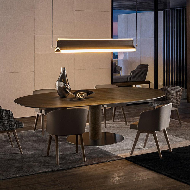 modern dining room featuring minotti reeves dining chairs