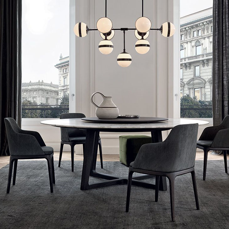 modern dining room featuring poliform grace dining chairs